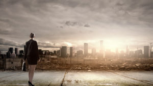 Business woman overlooking ruins of a major city with sun rising in background