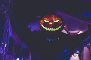 Man dressed as a Jack O'Lantern for Halloween