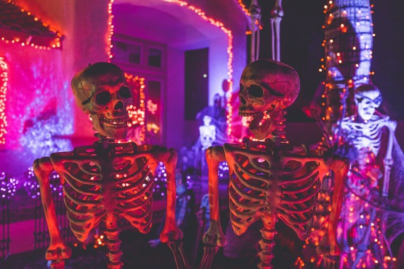 Halloween skeletons in front of a house
