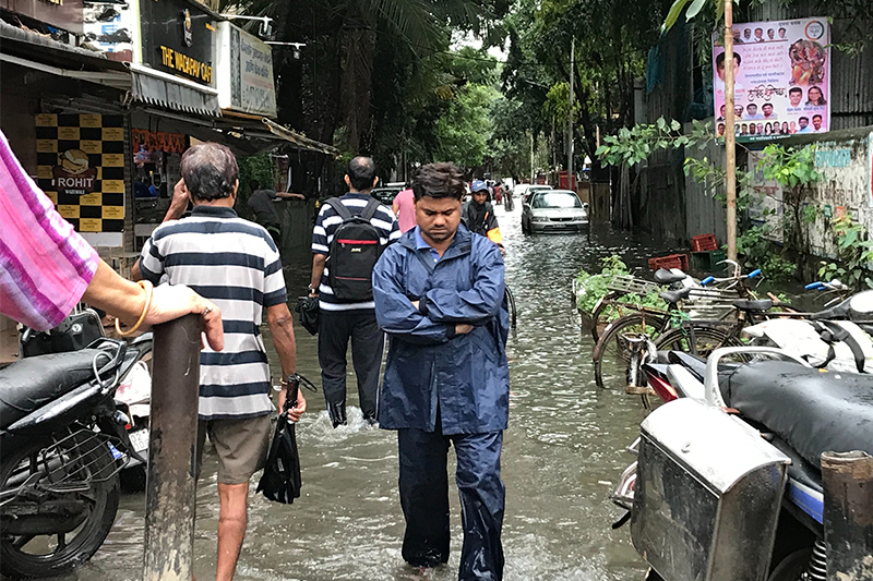 Man Navigating Flooded Streets